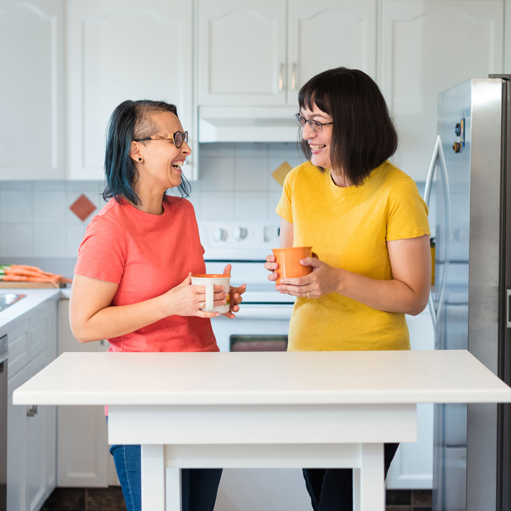 Claudia Tecuceanu, Alina Muresan, ladies laughing in kitchen, easy meal planning tips article, Health and Yum Canadian food blogger, foods to treat anxiety